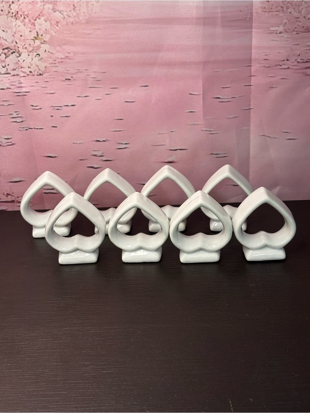 Set of 8 ceramic spade shaped napkin rings. Preowned